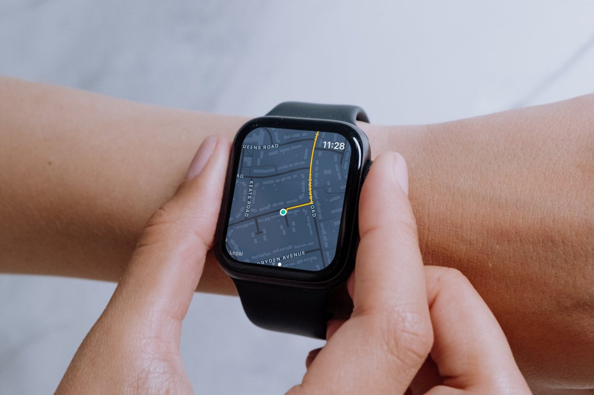 FitWalk on an Apple Watch, showing the walked route as a gold line on the map